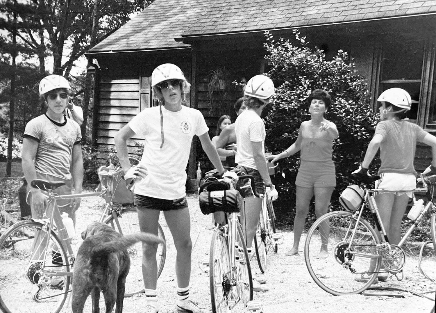 A black-and-white image of the founder and his friends with their bicycles as teenagers.